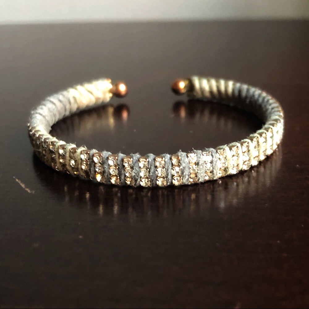 Suede and rhinestone cuff.